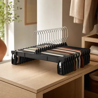 Plastic space-saving hangers with clips or bars – illustrative image, see the listing on Amazon for actual photos